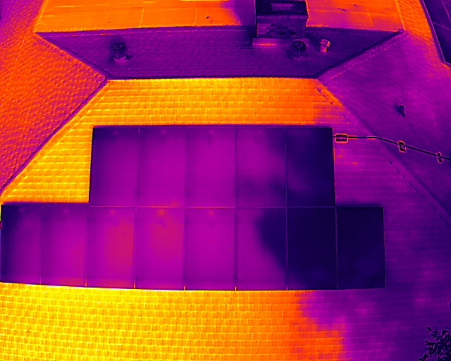 Thermal imaging scan of rooftop solar panels showing heat distribution